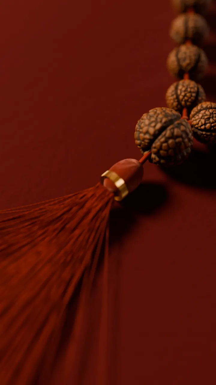 The sumeru and tassel of a rudraksha mala