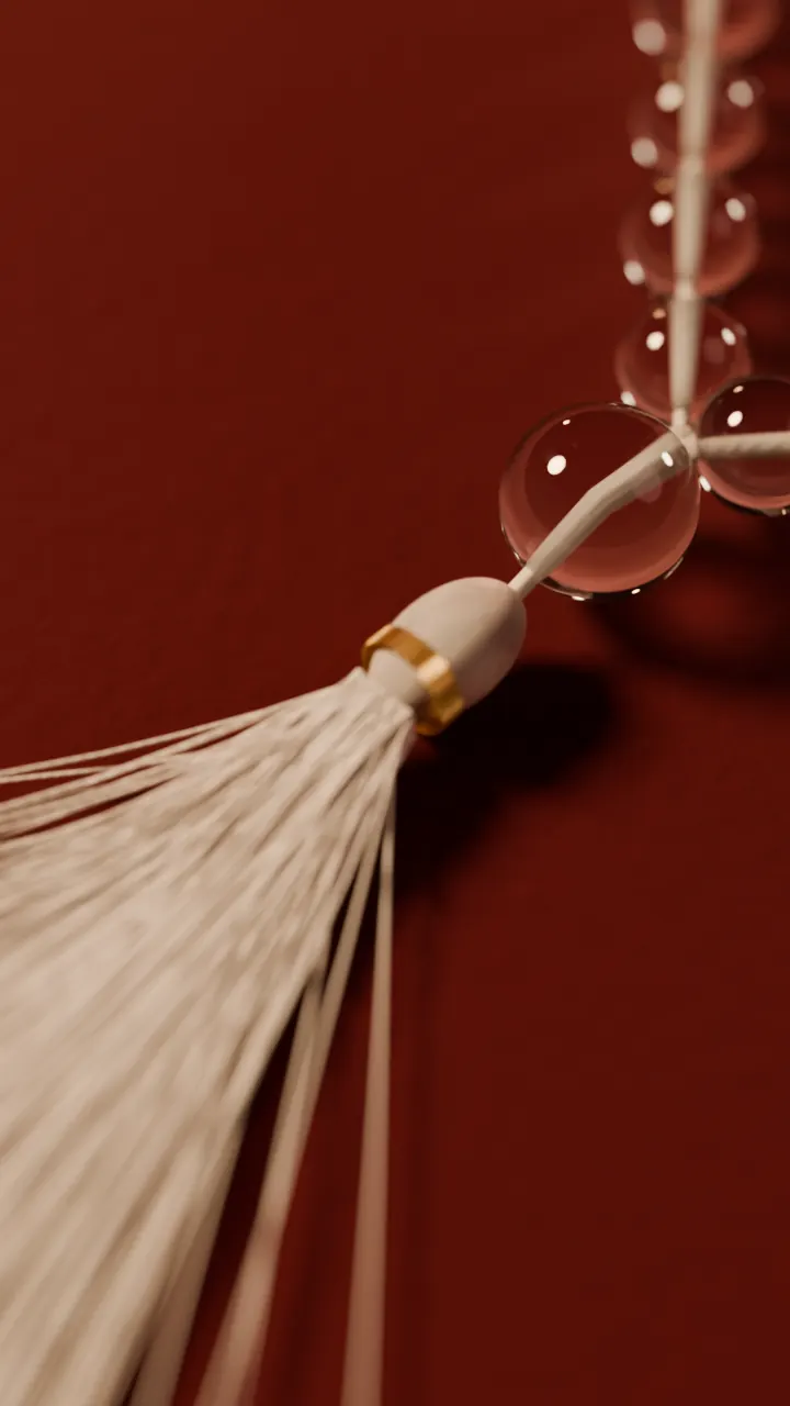 The sumeru and tassel of a sphatik mala